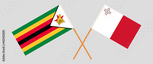 Crossed flags of Zimbabwe and Malta. Official colors. Correct proportion