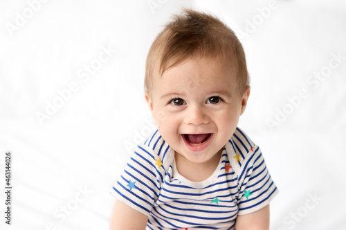 Portrait of cute laughing baby with brown eyes