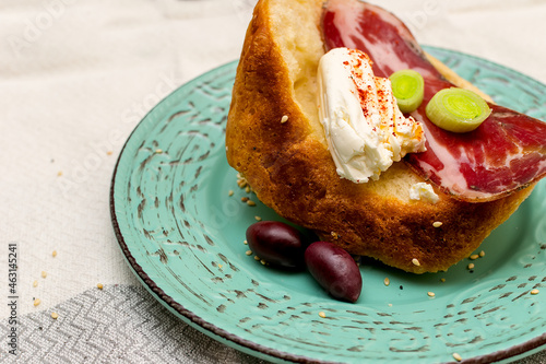 A slice of bread with Bulgarian salami, cheese and chutney photo