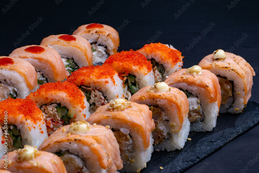 Japanese food. close-up view of delicious sushi set on slate boards Japanese food. close-up view of delicious sushi set on slate boards