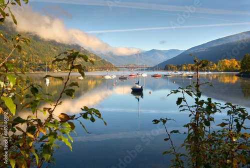 Kootenay Lake Morning Nelson BC. Boats anchored on Kootenay Lake in Nelson, British Columbia. The Big Orange Bridge crosses in the background.

 photo