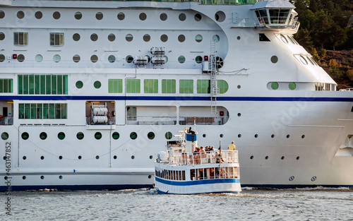 Photography Local ferry waiting for big Cruise liner to pass, Sweden, Stockholm