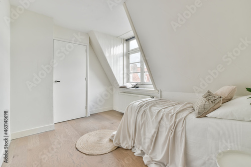 Light bedroom in a mansard of the house