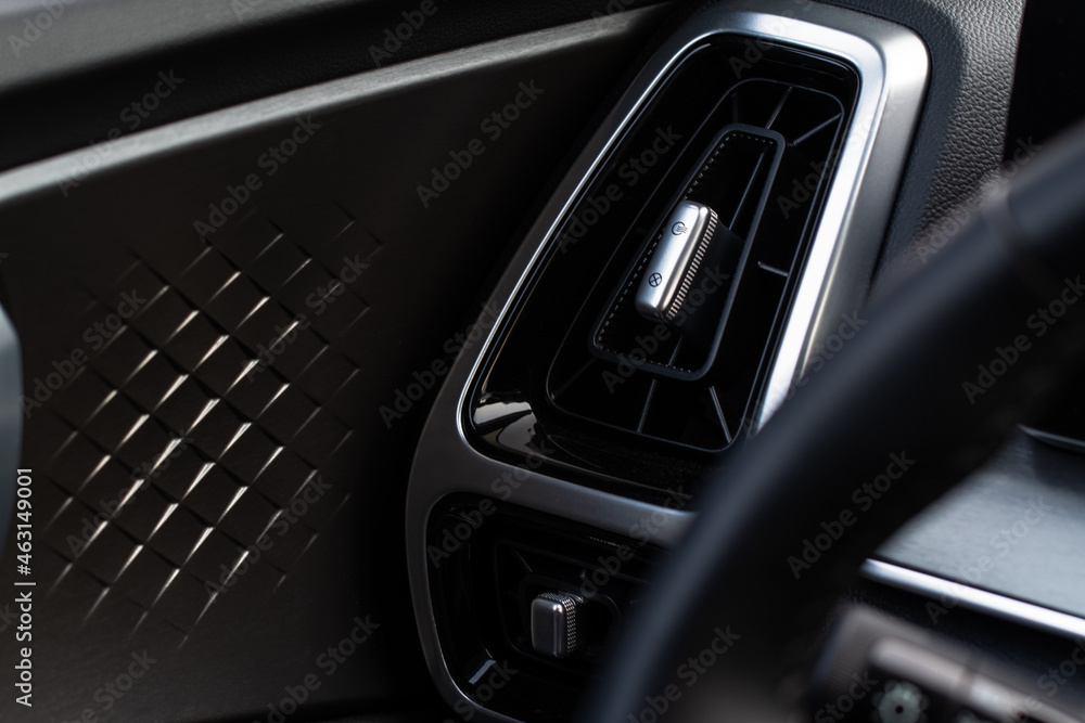 Car air conditioning close up view. The air conditioner flow inside the car. Detail interior of car. Air ducts.