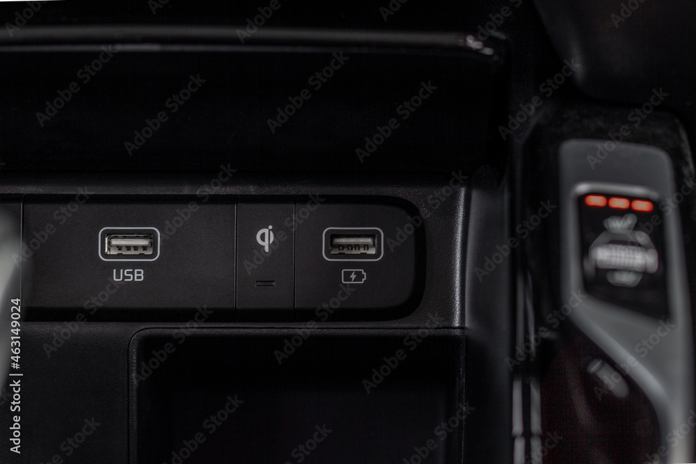 Fototapeta premium Car USB slots. 12 Voltage outlet. Wireless charger indicator.