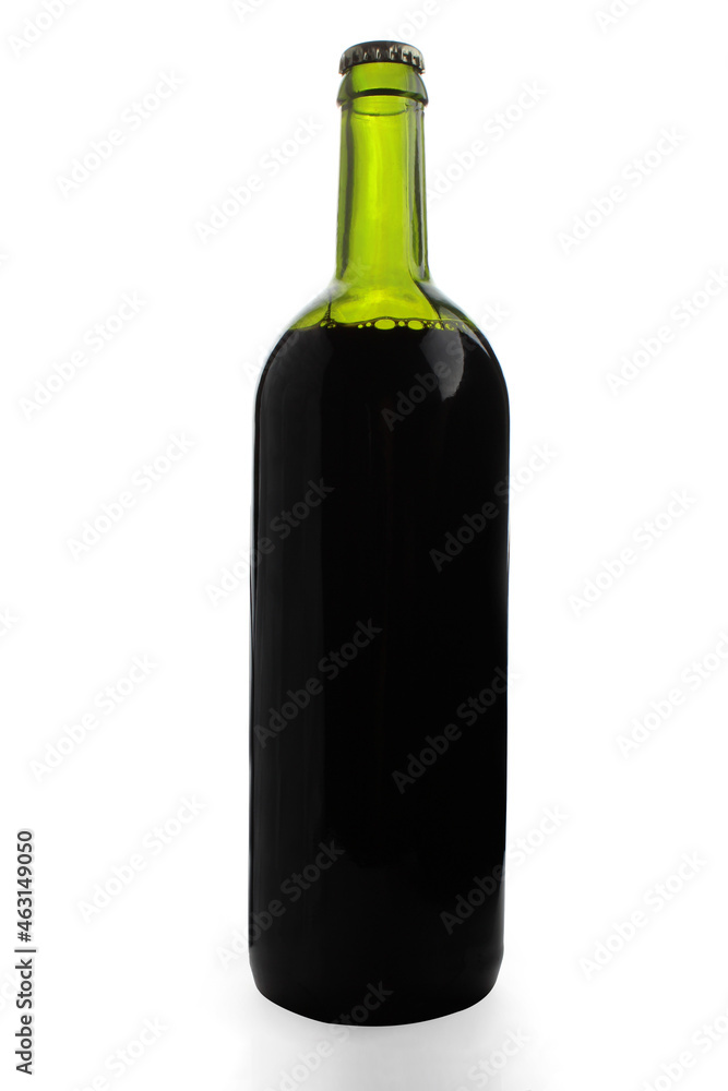 Closed green glass bottle full of dark liquid isolated on white background