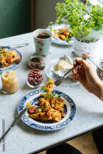 Wallpaper Mural Crop hand taking breakfast food from plate Torontodigital.ca