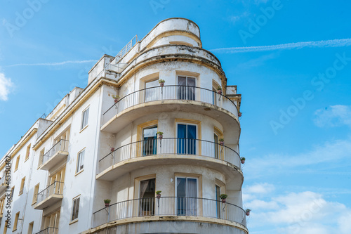 Old semicircular building with balconies photo