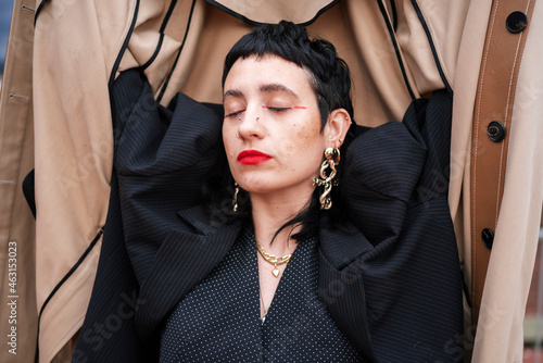 Stylish alternative woman with closed eyes photo