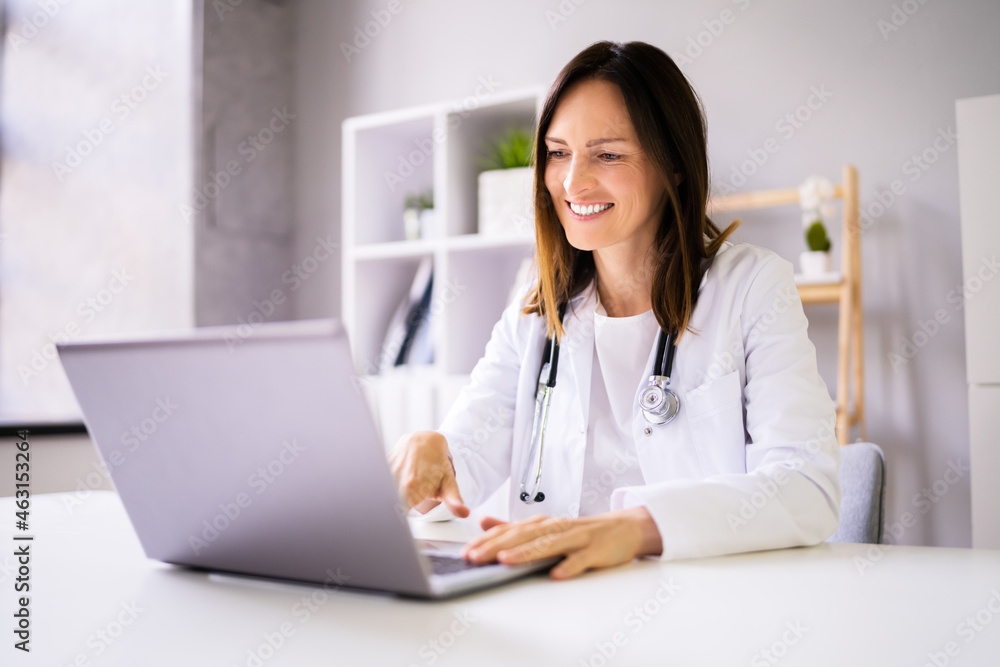 Doctor Having Video Conference On Laptop