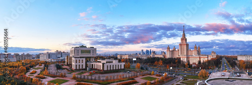 Aerial panoramic view of sunset campus of famous university under dramatic cloudy sky in autumn