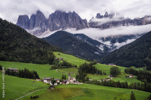 St Magdalena church in Val di Funes valley  Dolomites  Italy. Furchetta and Sass Rigais mountain peaks in background