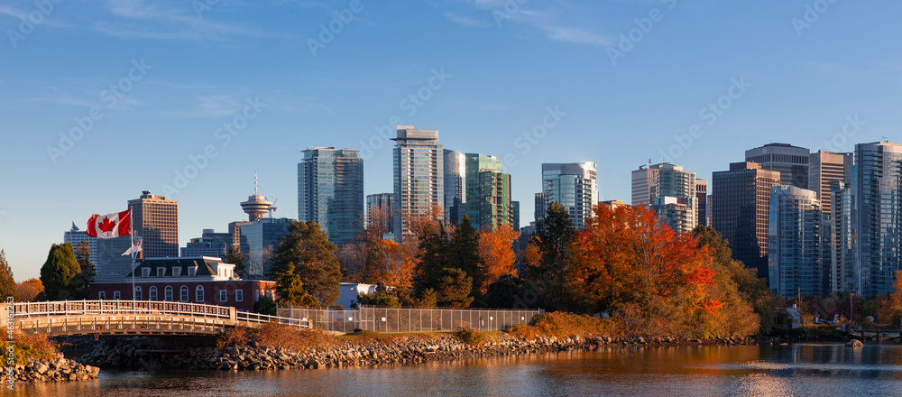 Fototapeta premium Downtown Vancouver Canada modern city panorama view Coal Harbor business district area high office and apartment buildings with Naval Museum at HMCS Naval Reserve with a large Canadian flag