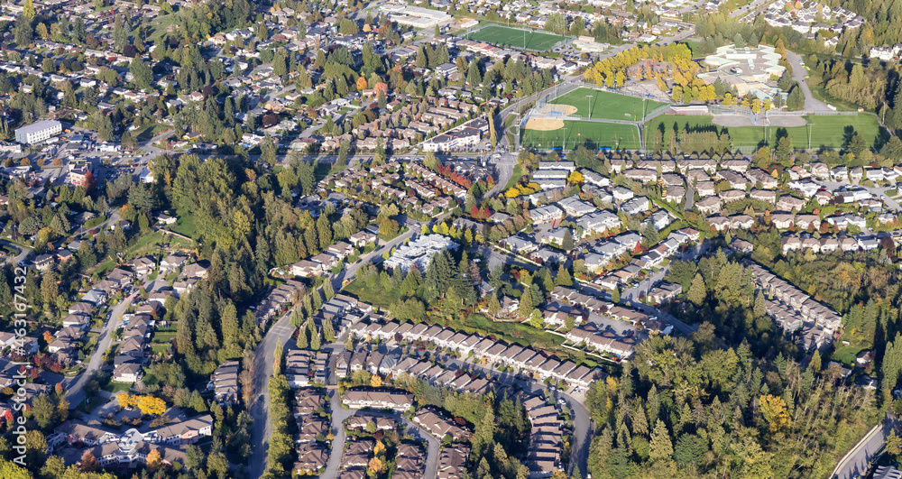 Obraz premium Residential Homes in Maple Ridge City in Greater Vancouver, British Columbia, Canada. Aerial View from Airplane. Sunny Fall Season.