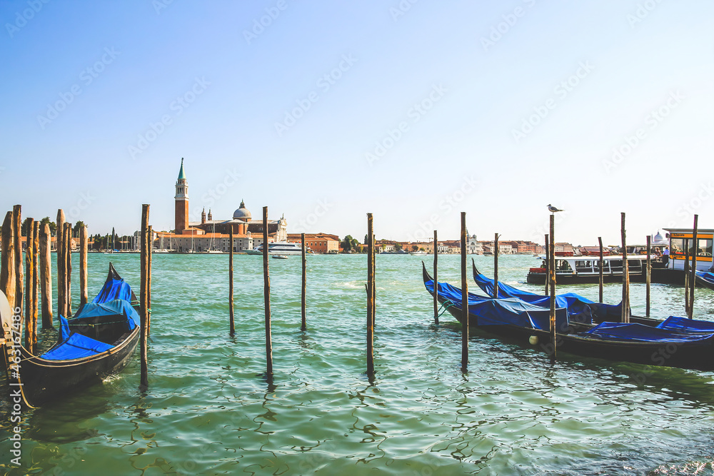 gondolas near the Doge's Palace in Venice, Veneto, Italy and San Giorgio Maggiore island