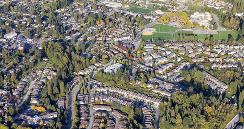 Residential Homes in Maple Ridge City in Greater Vancouver, British Columbia, Canada. Aerial View from Airplane. Sunny Fall Season. © edb3_16