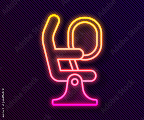 Glowing neon line Airplane seat icon isolated on black background. Vector