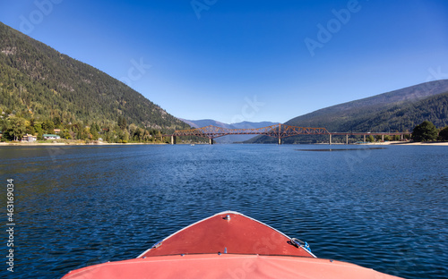 Boat riding on Kootenay River. Sunny Fall Season Morning. Located in Nelson, British Columbia, Canada.
