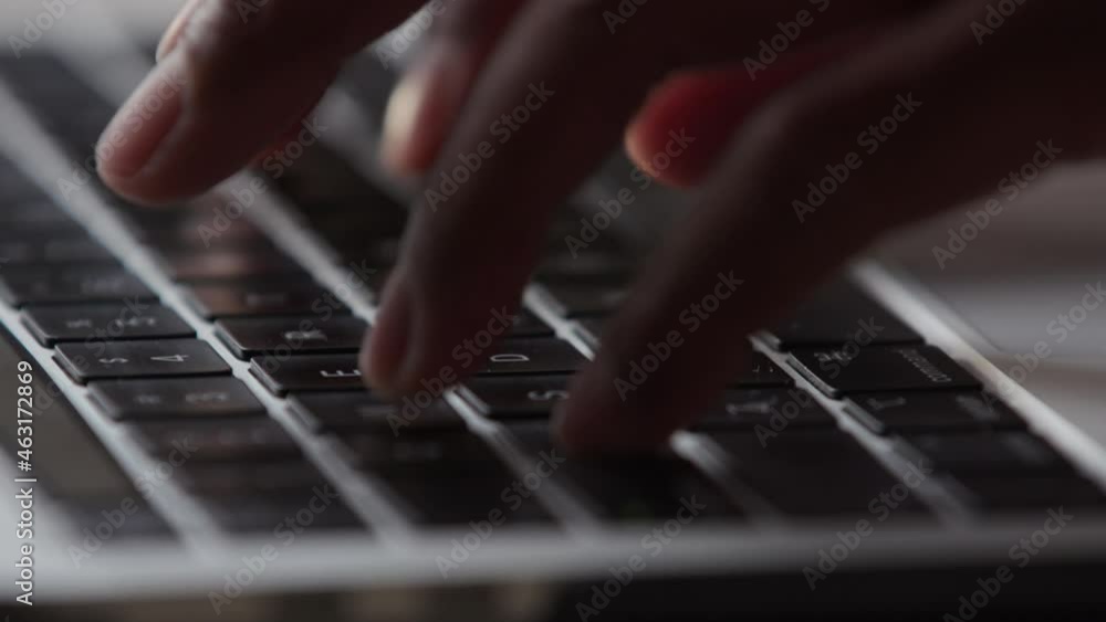 Close up of hands typing on a keyboard