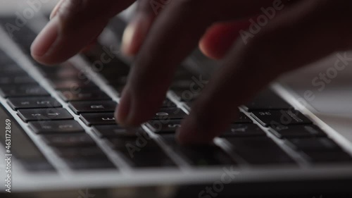 Close up of hands typing on a keyboard