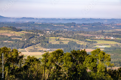Valley with farm fields and forest