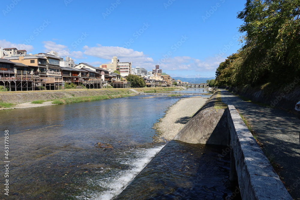 A cityscape of Kyoto in Japan日本の京都の一都市風景 : the Kamo River flowing through Kyoto and Sanjo-ohashi Bridge 京都を貫流 する鴨（賀茂）川と三条大橋