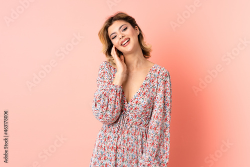 Young Russian woman isolated on pink background with toothache