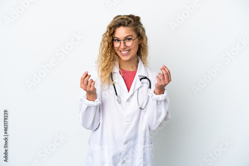 Young doctor blonde woman isolated on white background making money gesture