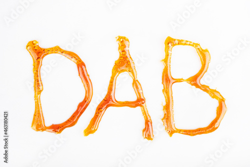 Картината върху платно the word dab from golden concentrated cannabis wax