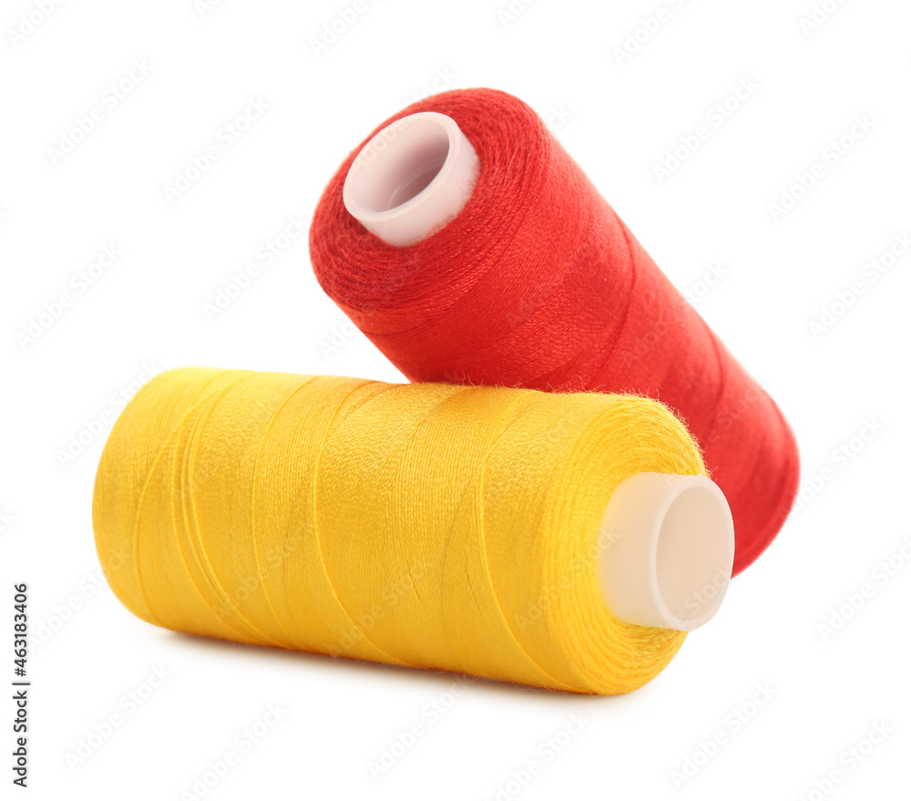 Different colorful sewing threads on white background Different colorful sewing threads on white background