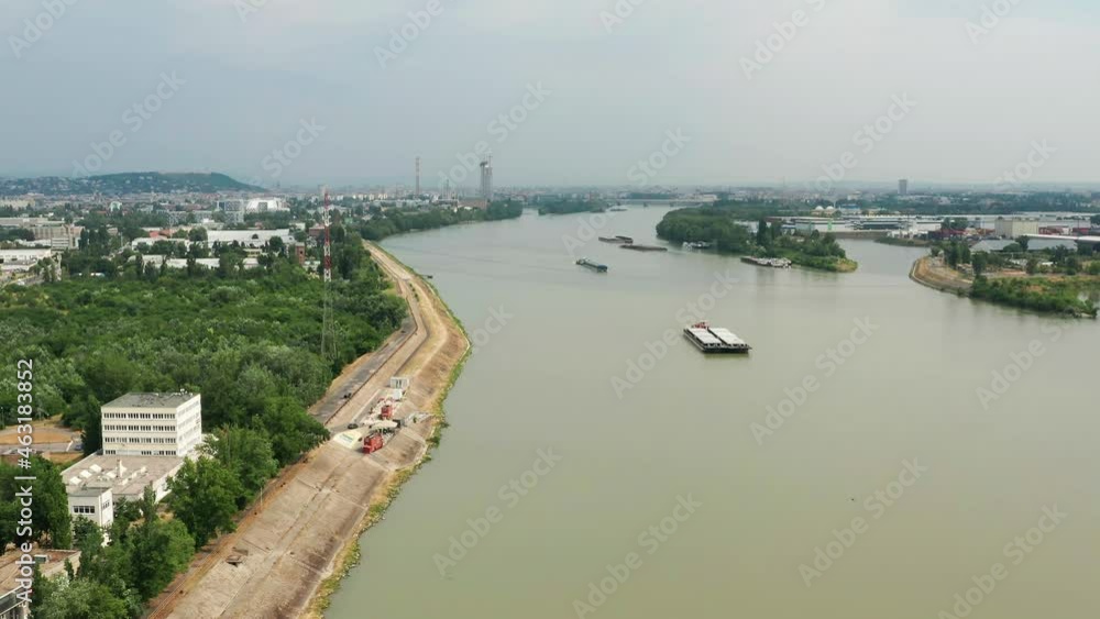 Cargo barges on the Danube in southern Budapest. Aerial 4K view. Cargo barges on the Danube in southern Budapest. Aerial 4K view.