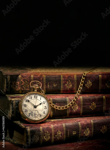 Old vintage pocket watch and books