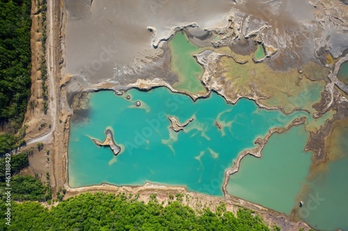 Schilderij op canvas Drone view of the turquoise lake formed as a result of mining waste