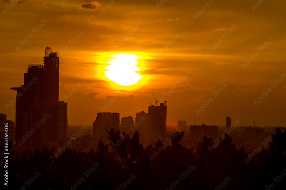 The high angle background of the city view with the secret light of the evening, blurring of night lights, showing the distribution of condominiums, dense homes in the capital community The high angle background of the city view with the secret light of the evening, blurring of night lights, showing the distribution of condominiums, dense homes in the capital community