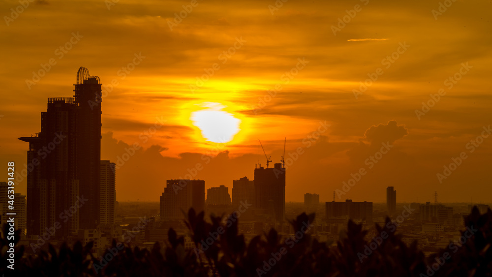 The high angle background of the city view with the secret light of the evening, blurring of night lights, showing the distribution of condominiums, dense homes in the capital community The high angle background of the city view with the secret light of the evening, blurring of night lights, showing the distribution of condominiums, dense homes in the capital community