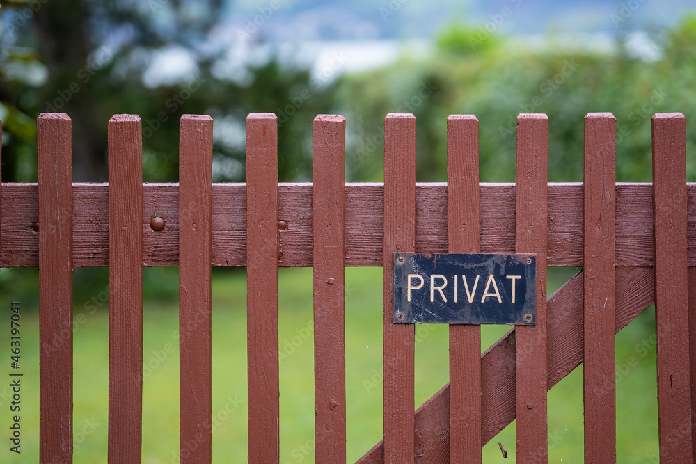 Private sign on the fence in Austria, private ground - no trespassing, close up Private sign on the fence in Austria, private ground - no trespassing, close up