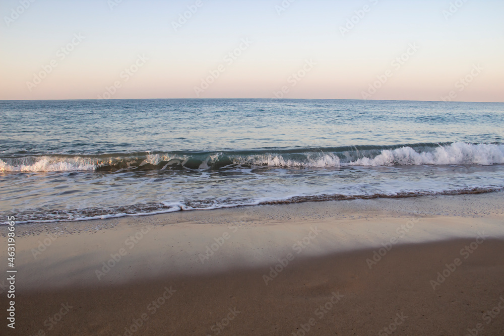 Beautiful seascape with sea waves and sand. Sea waves on the beach.