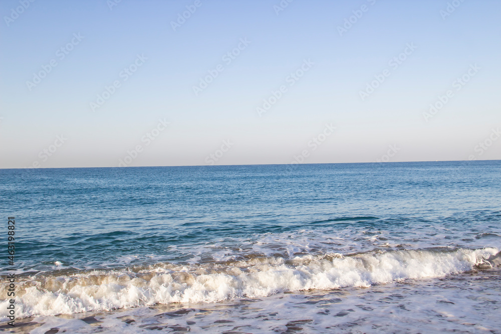 Fototapeta premium Beautiful seascape with sea waves and sand. Sea waves on the beach.