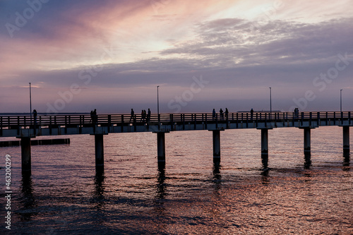 lilac sunset over the sea, promenade, pier