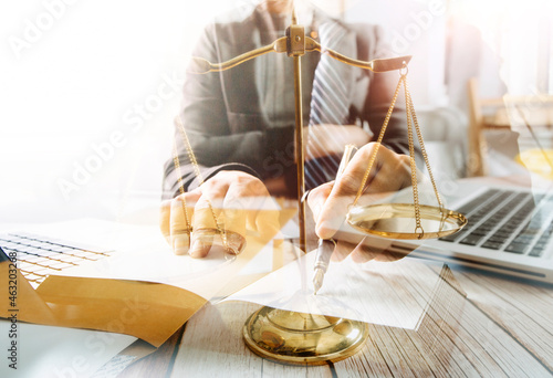 Close up lawyer businessman working or reading lawbook in office workplace for consultant lawyer concept.