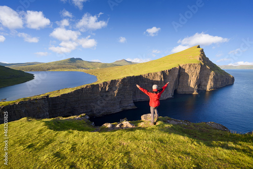 Tourist enjoys the view of Lake Sorvagsvatn on Vagar Island, Faroe Islands photo