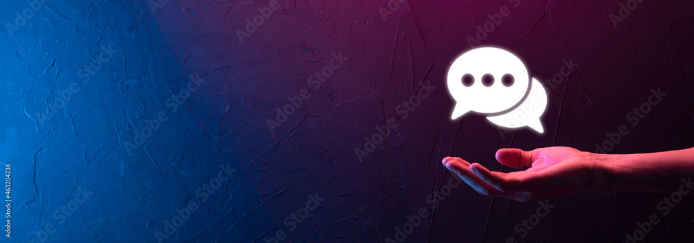 Businessman holding a message icon, bubble talk notification sign in his hands. Chat icon, sms icon, comments icon, speech bubbles Businessman holding a message icon, bubble talk notification sign in his hands. Chat icon, sms icon, comments icon, speech bubbles