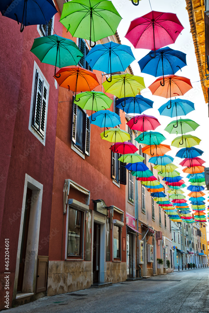 Street in Novigrad decorated with umbrellas