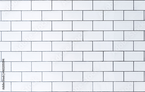 White tile background. Wall with white tiles for the interior of the kitchen or bathroom in the house. Decor, design and decoration of kitchen and bathroom interiors