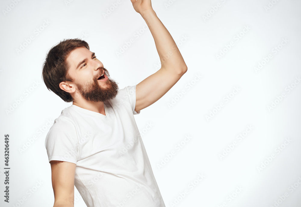 sad man in white t-shirt emotions posing light background