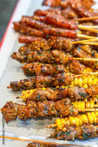 A plate of grilled skewers with rich ingredients