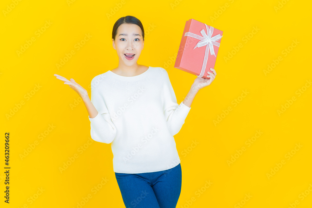 Portrait beautiful young asian woman smile with red gift box Portrait beautiful young asian woman smile with red gift box