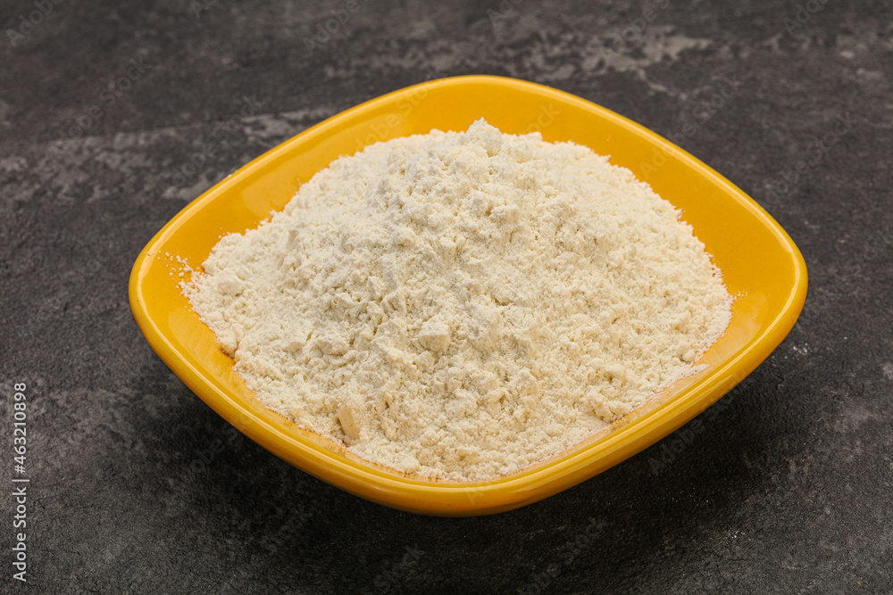 Wheat flour heap in the bowl Wheat flour heap in the bowl