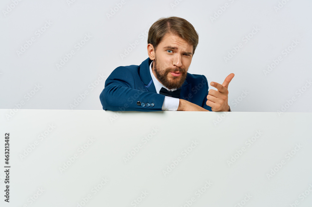 Cheerful man white banner in hand blank sheet presentation White background Cheerful man white banner in hand blank sheet presentation White background