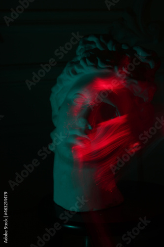 head of david in colored lighting in a photo studio